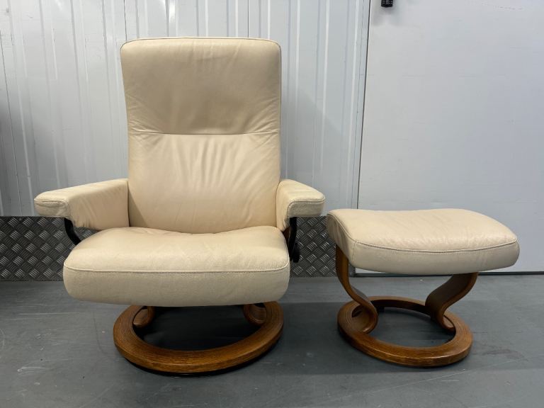 Ekornes Stressless cream leather recliner chair with matching stool