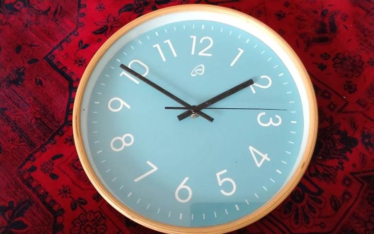 Light Blue Wall Clock with Wooden Frame – Good Condition