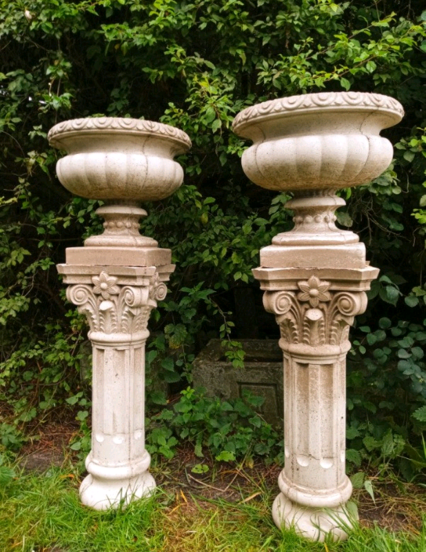 Pair of large 1.4m tall stone Urns and plinths