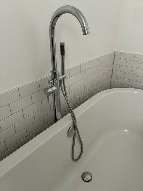 Freestanding Roca bath with mixer taps + showerhead