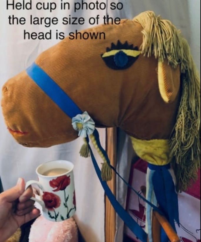 4ft tall, vintage  Large head wooden hobby horse attached to wooden wheels