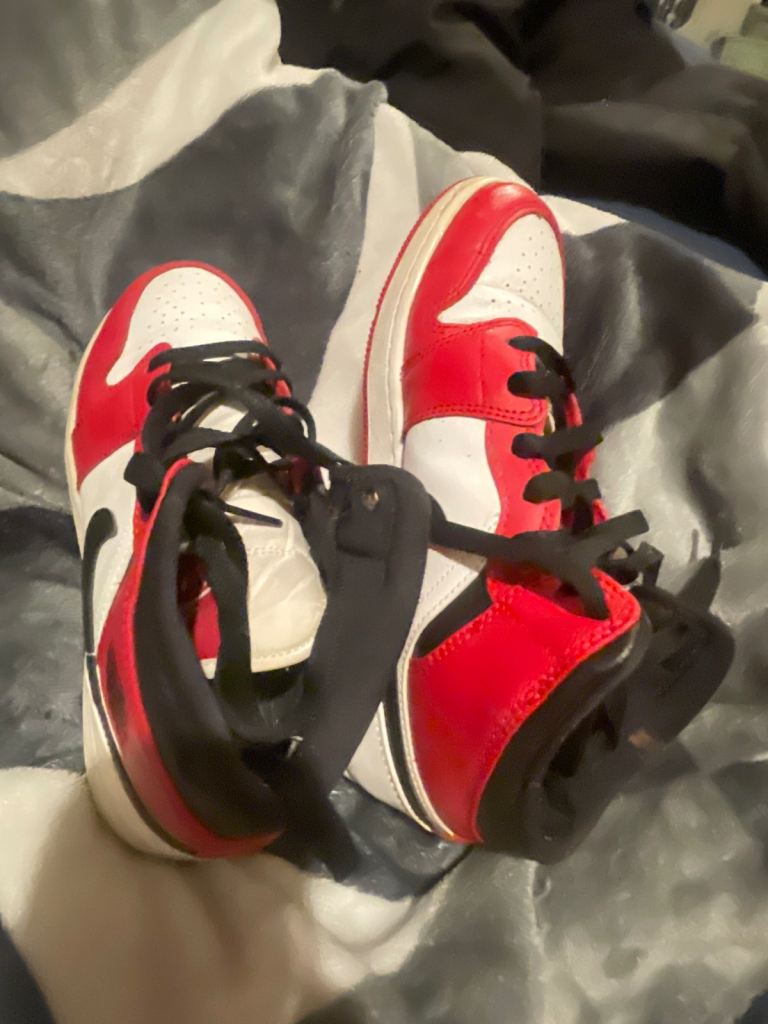 Red and black and white Jordan 4s 