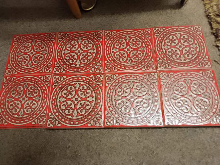 Late 60s/70s 22 Ceramic wall tiles by H + R Johnson Ltd. Red in colour with an embossed finish.