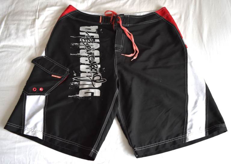 Very rear Vintage Black 'DOTCOM SURF' 'Bringabong' board shorts