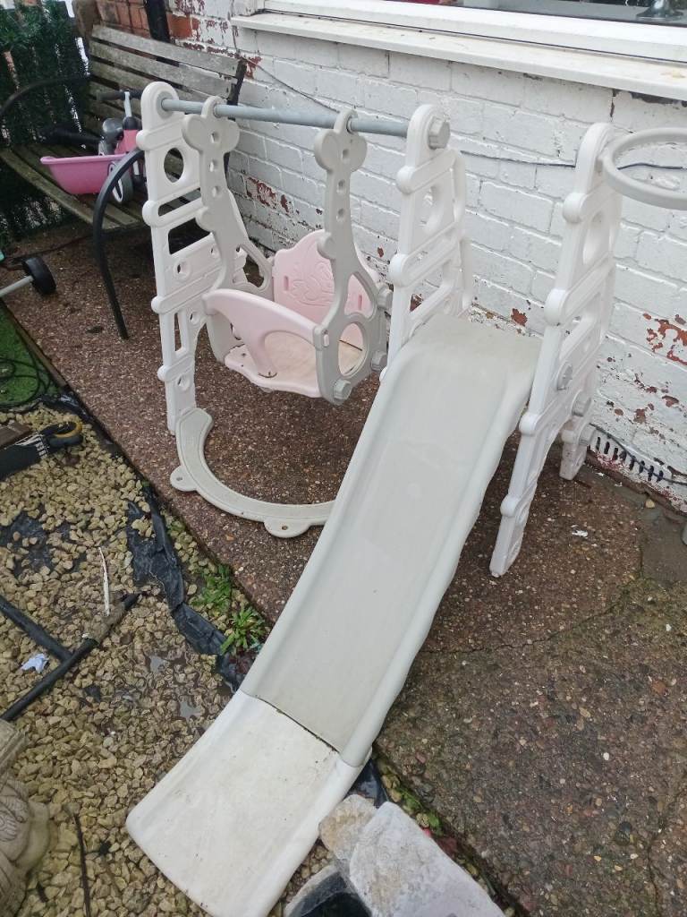 Babys pink slide and swing set 