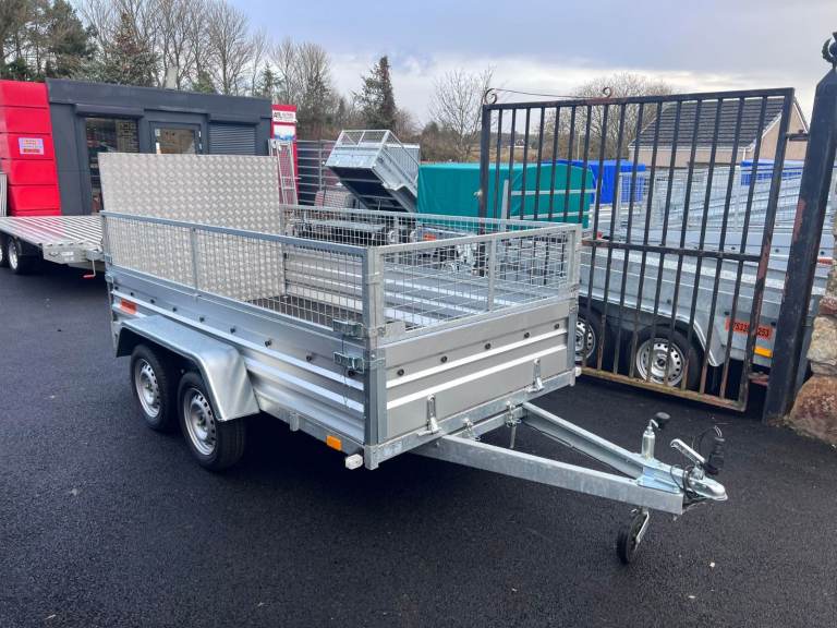 BRAND NEW 10FT X 5FT TWIN AXLE TRAILER WITH 40CM MESH AND RAMP 750KG UN BRAKED