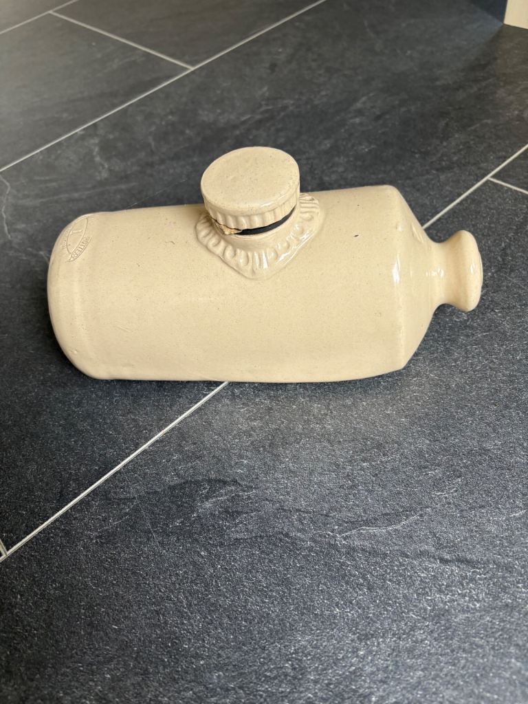 Ceramic hot water bottle / doorstop