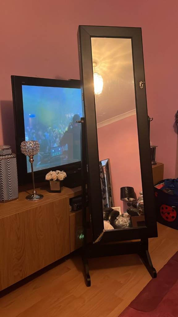£25. Large stand alone mirror with built in jewellery cabinet,which has key to lock  
