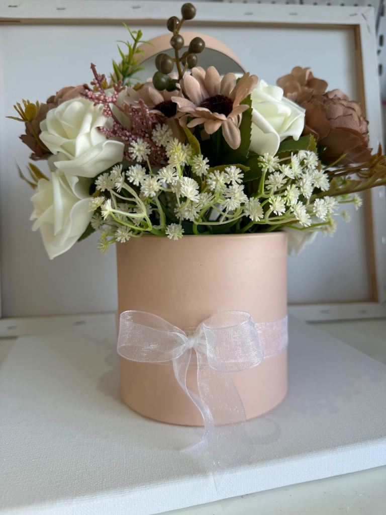 Hat box style flowers in cappuccino colours