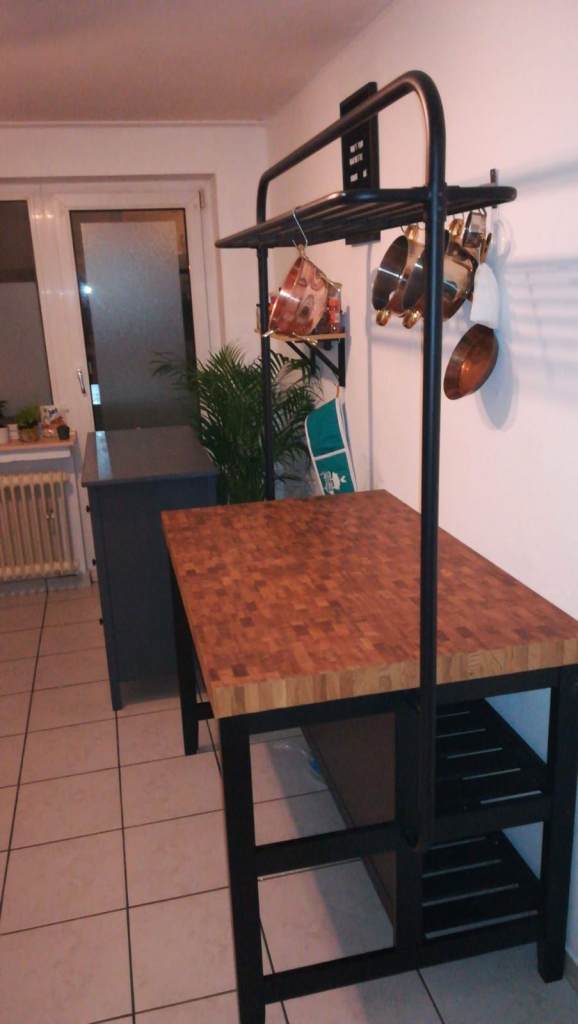 VADHOLMA Kitchen island with rack, black/oak, 126x79x193 cm Excellent condition