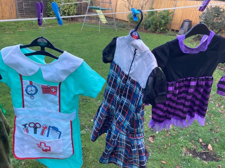 Girls dressing up box of outfits