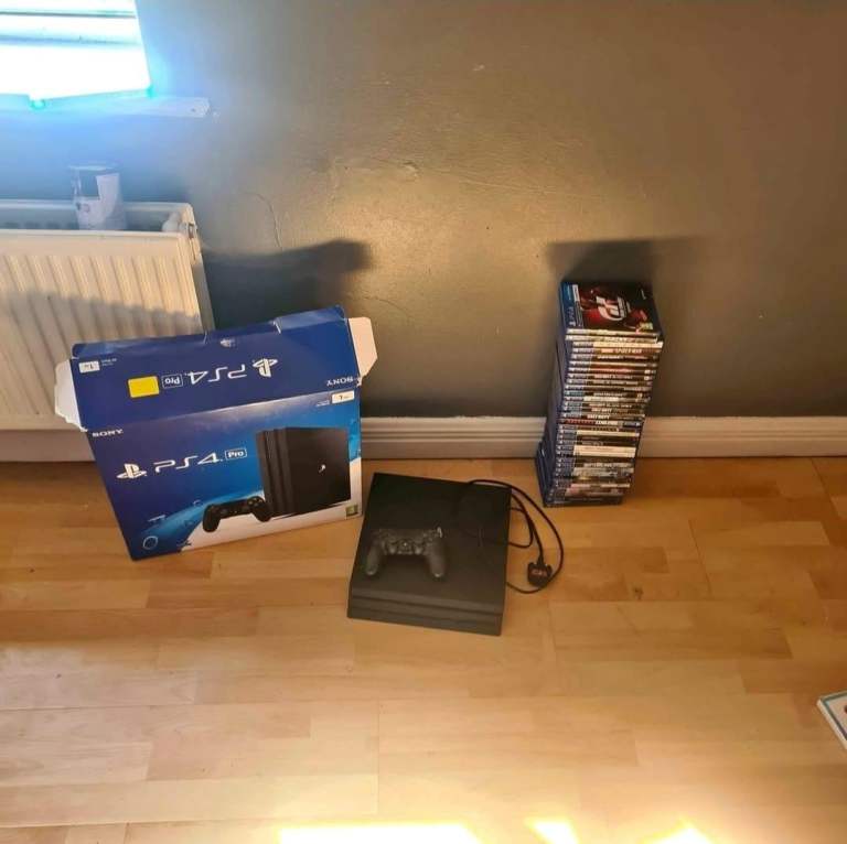 Sony PlayStation 4 Pro Console with Controller and Games
