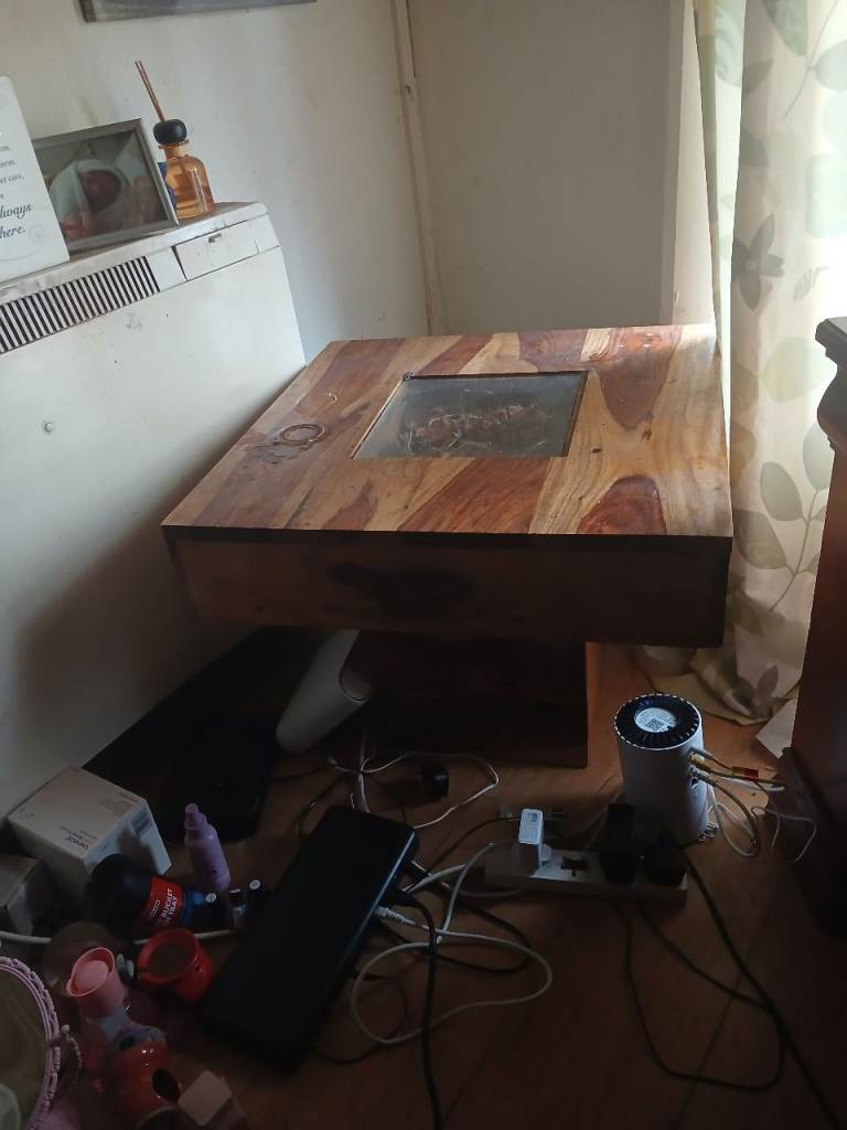 Wooden coffee table with centre glass 