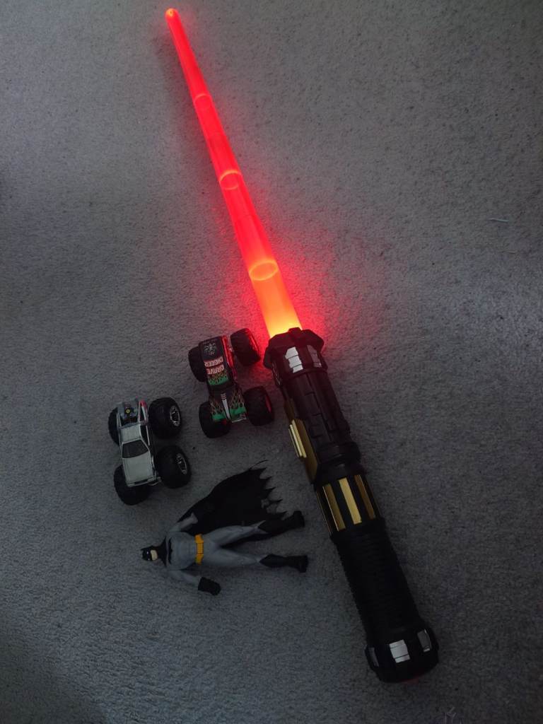 Light-Up Light Saber with sound , Monster Trucks, and Batman Figure Bundle