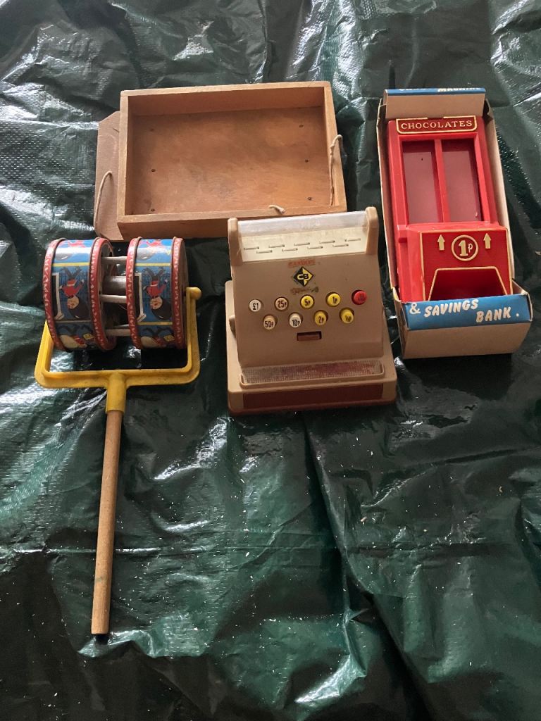 Vintage Toy Bundle: Cash Register, Chocolate Bank, and Spinning Toy