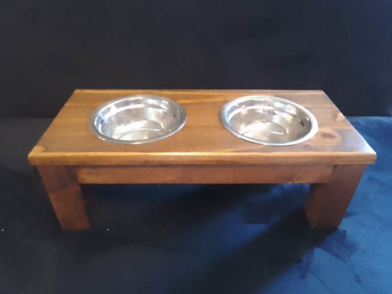 Raised feeding bowl stands for cats and small dogs.