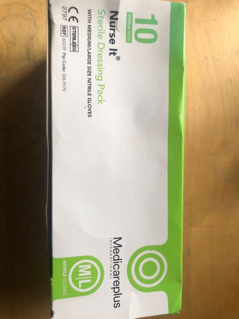 2 boxes full of dressings and bandages