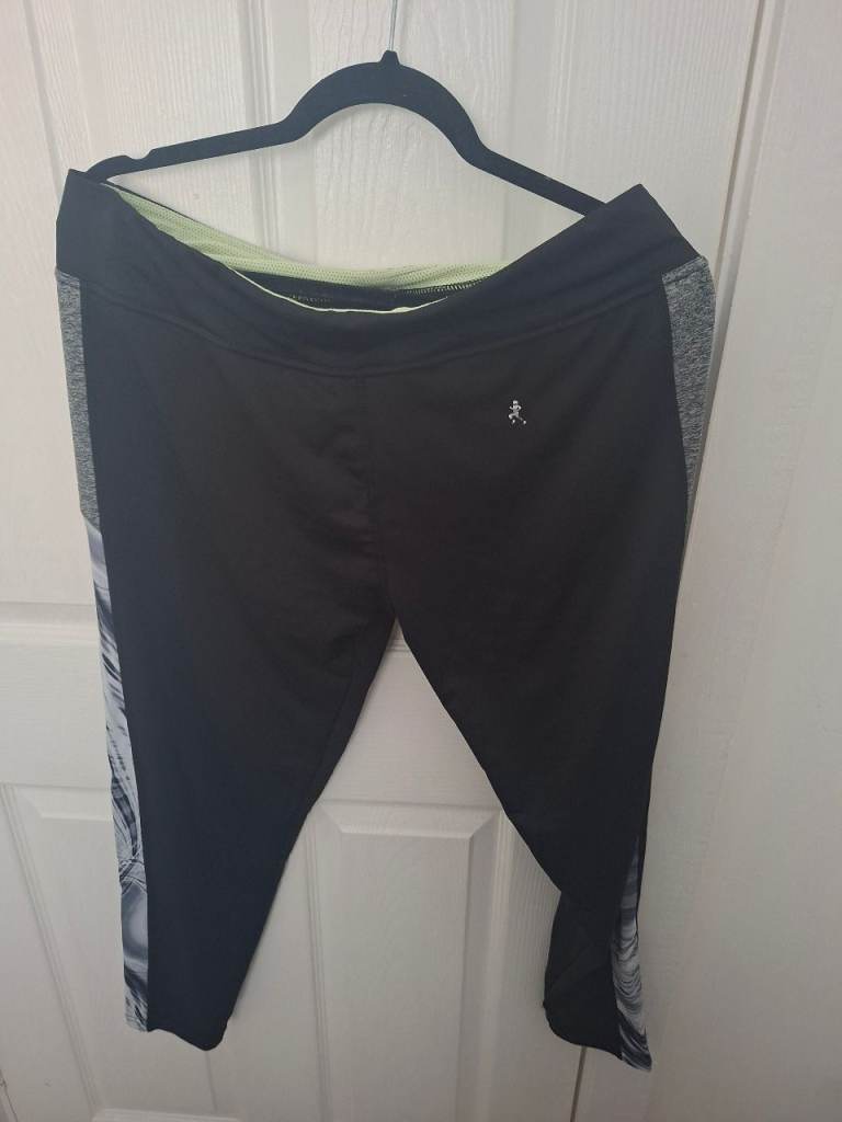 Black Joggers. Size 16. Pattern on side of each leg. Tie-waist. Zipped pocket on waist at the back