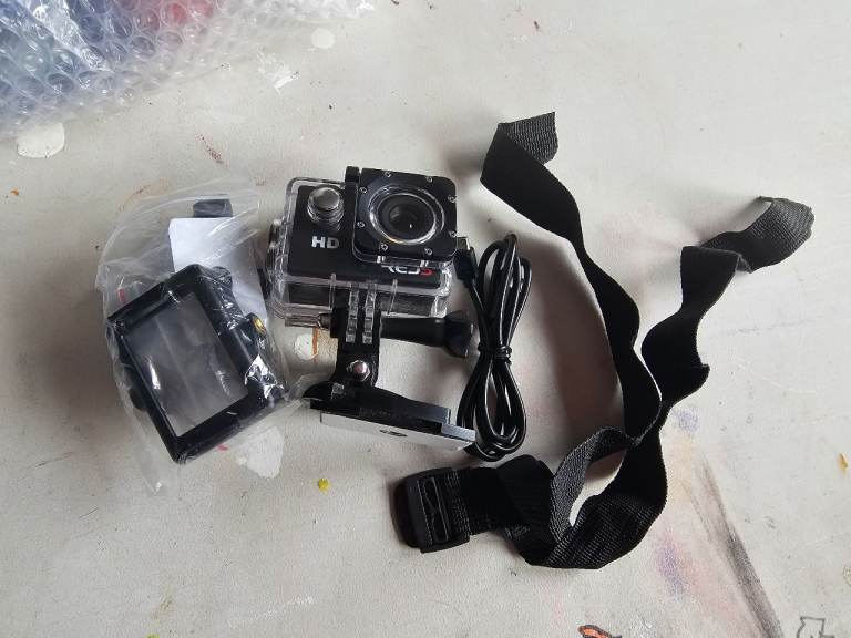 HD Action Camera with Waterproof Case and Mounts – Good Condition