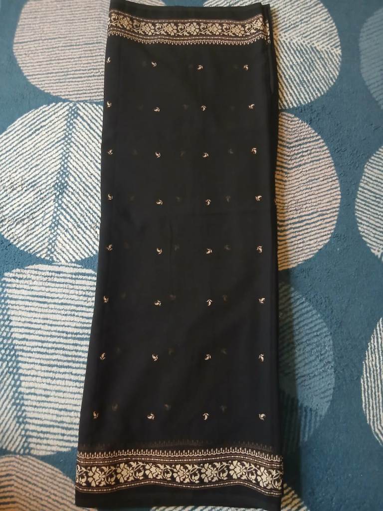 black saree with gold print design
