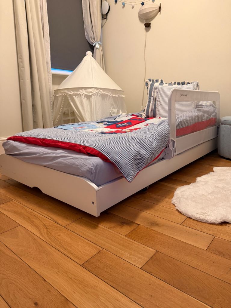 White wooden single bed, legs can be untucked for a higher bed 