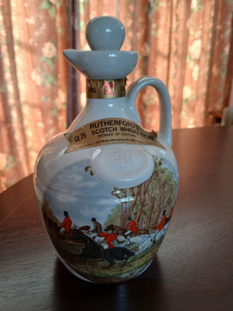 Scotch Whisky Decanter and  six decorative jugs