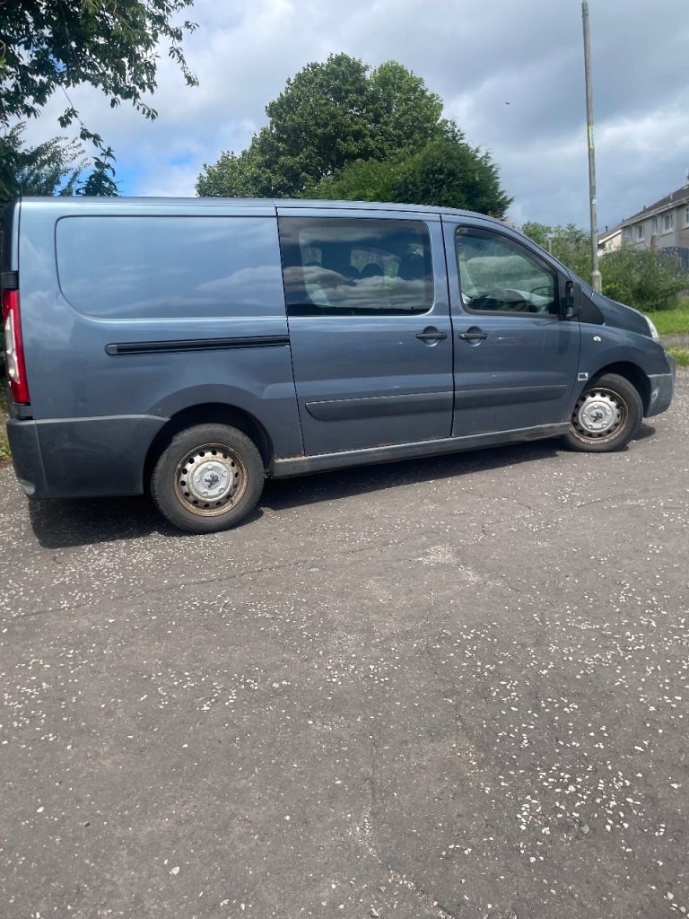 Blue Panel Van with Side Windows - Fair Condition