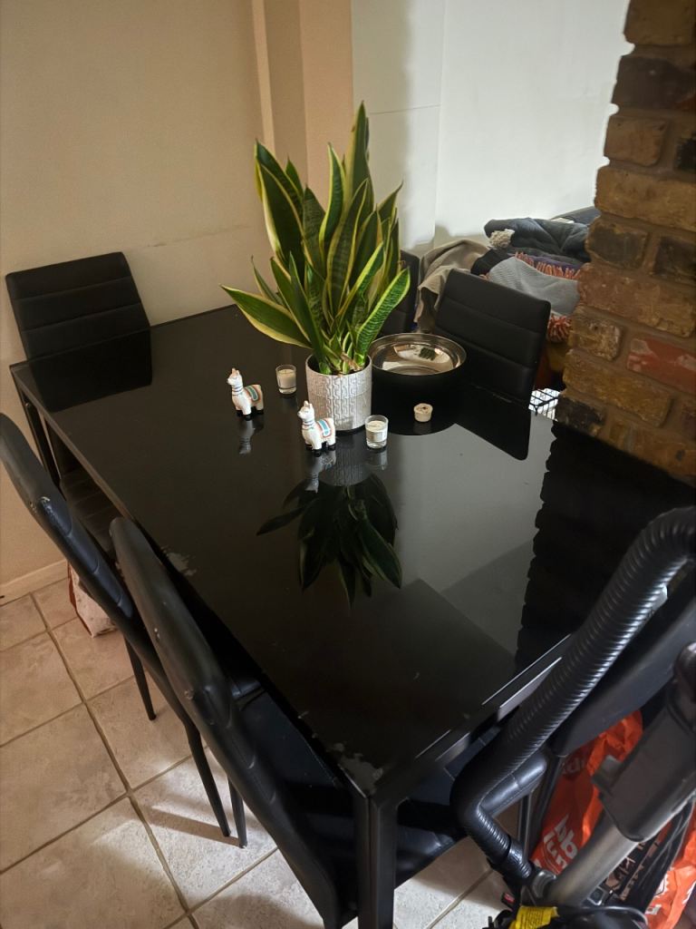 Black Dining Table and 6 Chairs. Must go today
