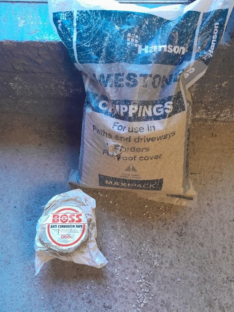Full Roll Denso Protective Tape and Nearly Full bag Of Lime Soakaway Chippings