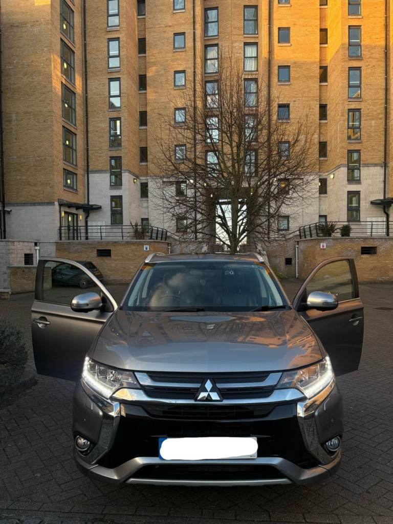 Grey 2016 Mitsubishi Outlander hybrid SUV