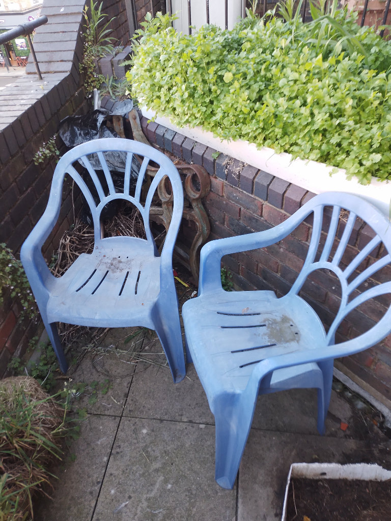 2 blue patio chairs