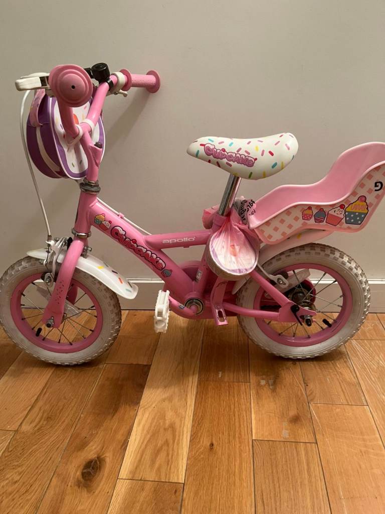 Apollo Cupcake girls first bike, 12" wheels, dolls seat, chain guard, V-brakes, stabilisers
