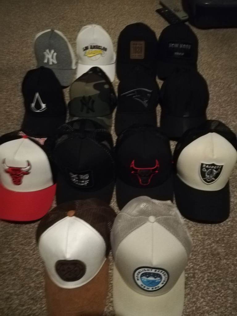 12 Mens New Era Trucker Caps. Some lightly used, some new, some worn
