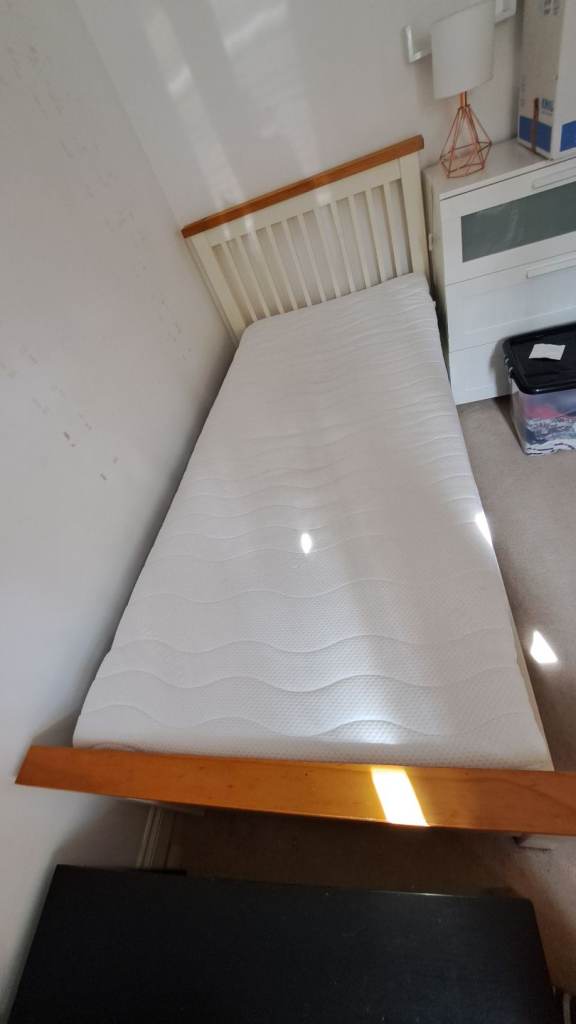 IKEA wooden single bed. New mattress and topper included.