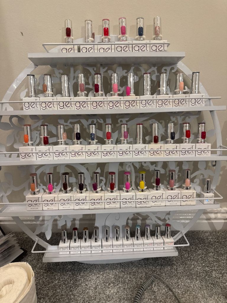 Assorted gel nail polishes and Acrylic tips  