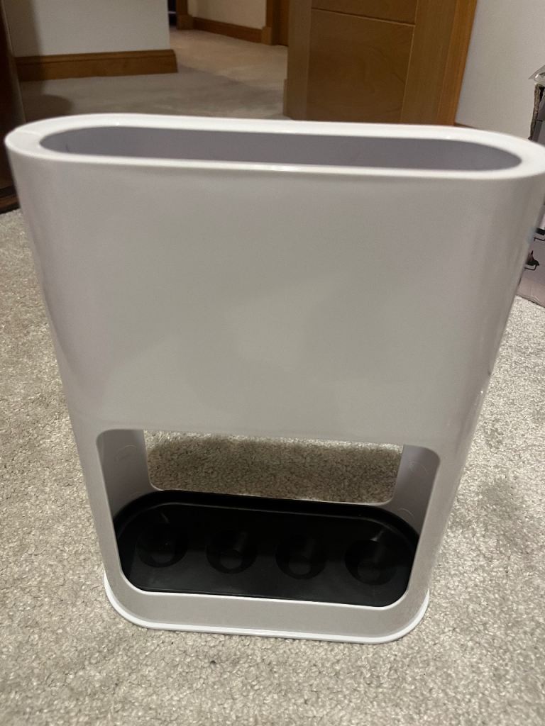 Umbrella stand for 4 umbrellas. Removable water tray. Brand new in box.