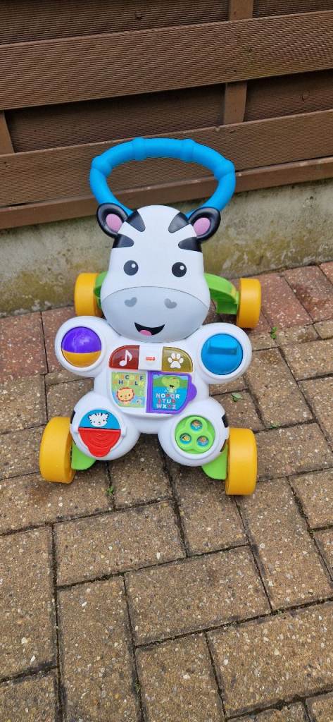 FISHER PRICE LEARN WITH ME ZEBRA WALKER. INCLUDES BATTERIES. EXCELLENT CONDITION.