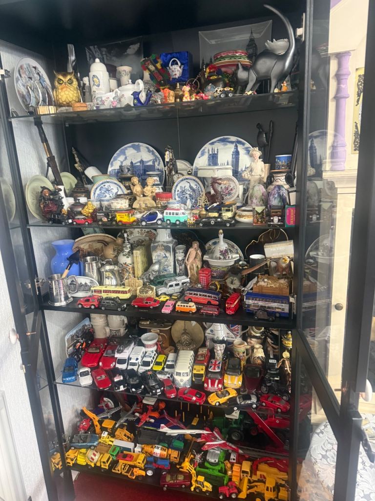 A very large collection of various die-cast vehicles and other collectible items.