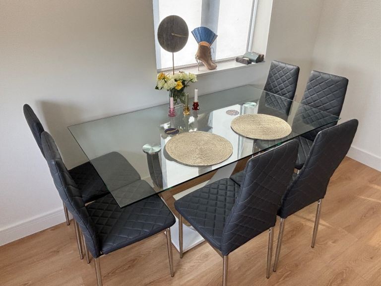 Glass Dining Table with White Gloss Base with 6x Grey Diamond Quilted Chairs
