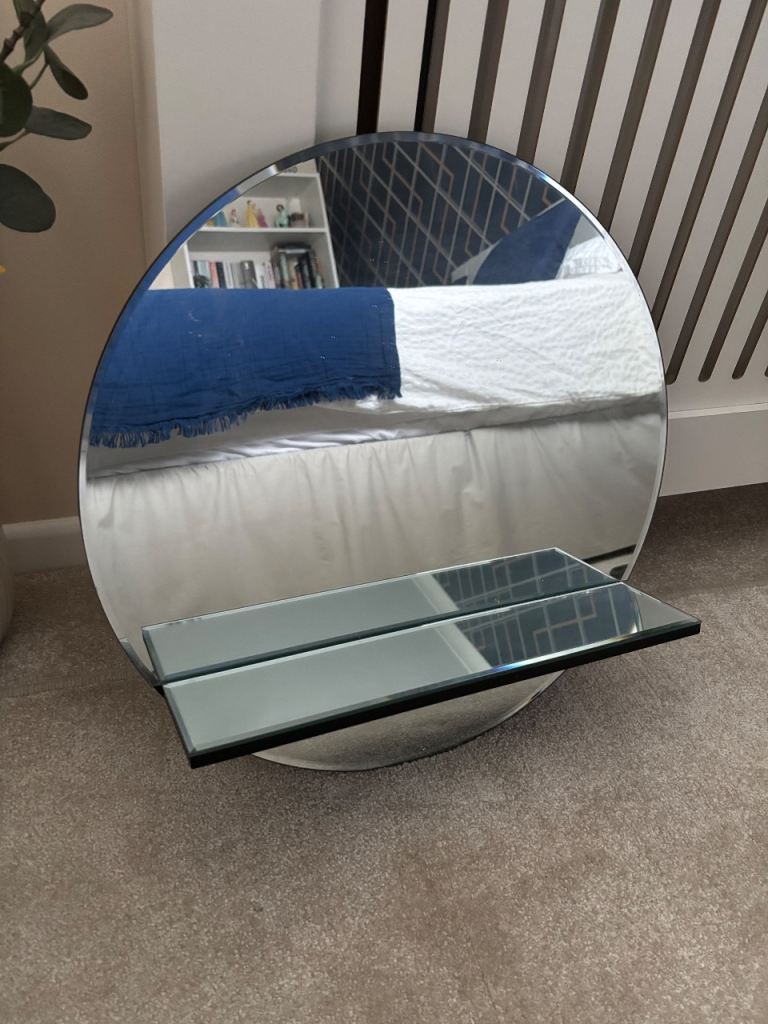 Round mirror with shelf