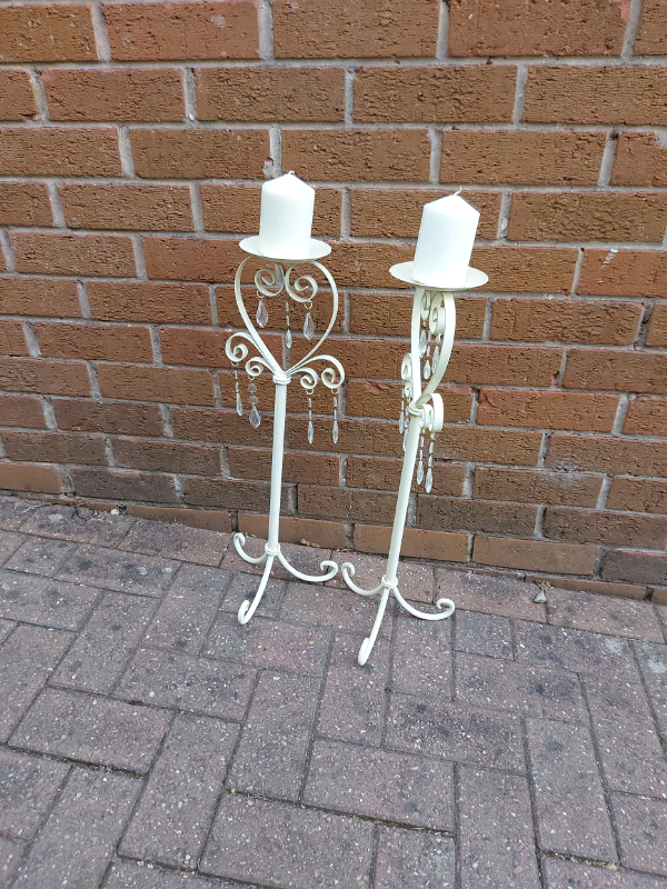 Pair of metal tall candle sticks holders 