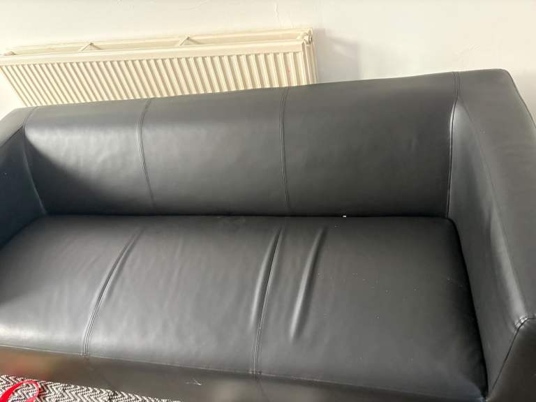 Black Leather Two-Seater Sofa – Good Condition