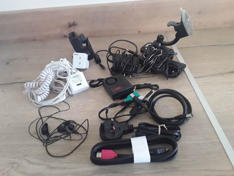 Assortment of chargers/ EU Plugs/ Sky cables/Car phone Holders/ inn ear Headphones  