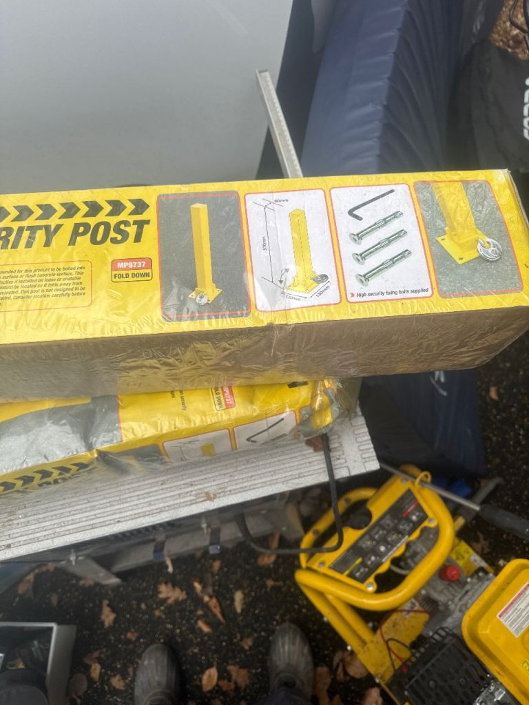 Fold down bolted security post 