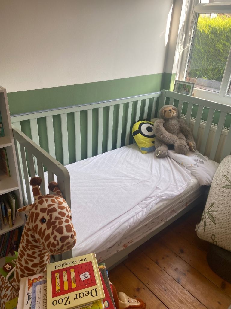 Green unisex baby cot. John Lewis. Can be used as toddler bed