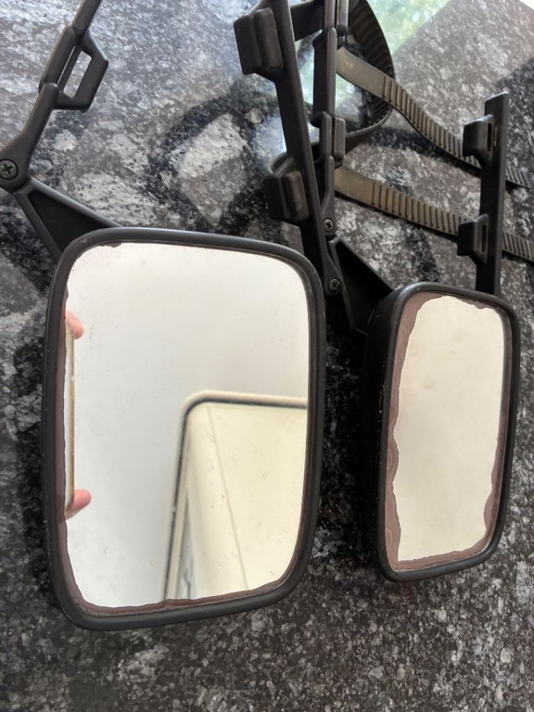 universal clip-on caravan towing mirrors with adjustable rubber mounting straps.