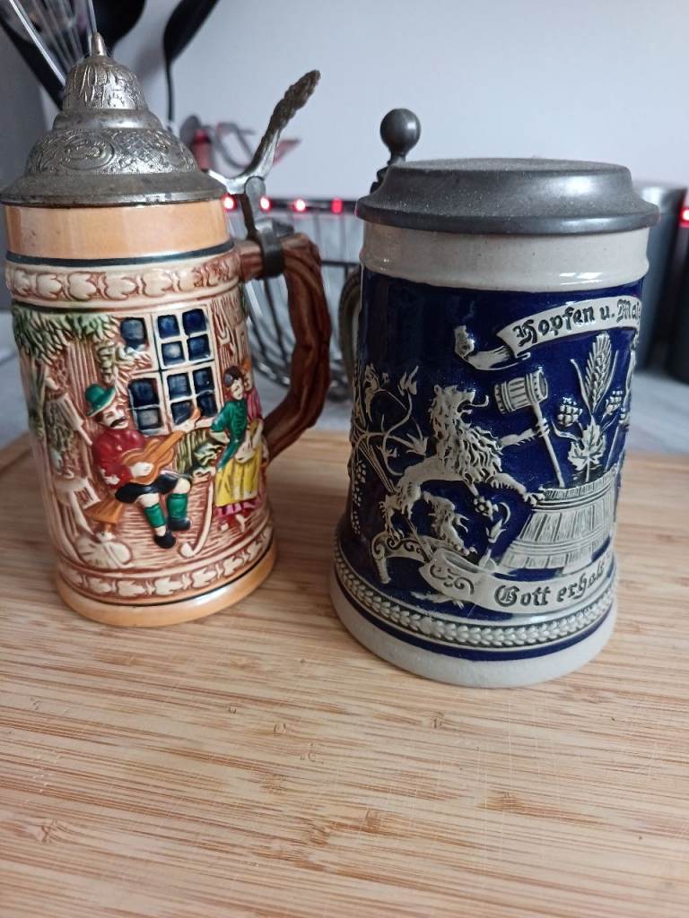 Two Vintage German Beer Steins with Pewter Lids