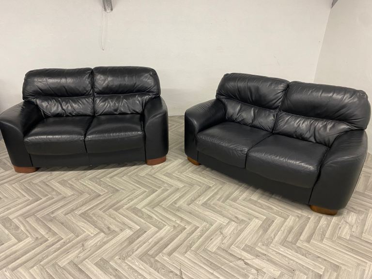 image for Reid’s black leather 2 & 2 sofas