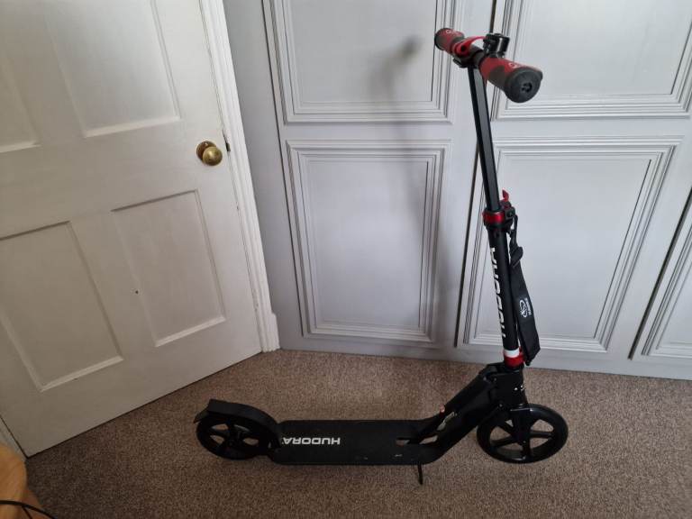 Hudora adult push scooter in sleek  and red. Never used