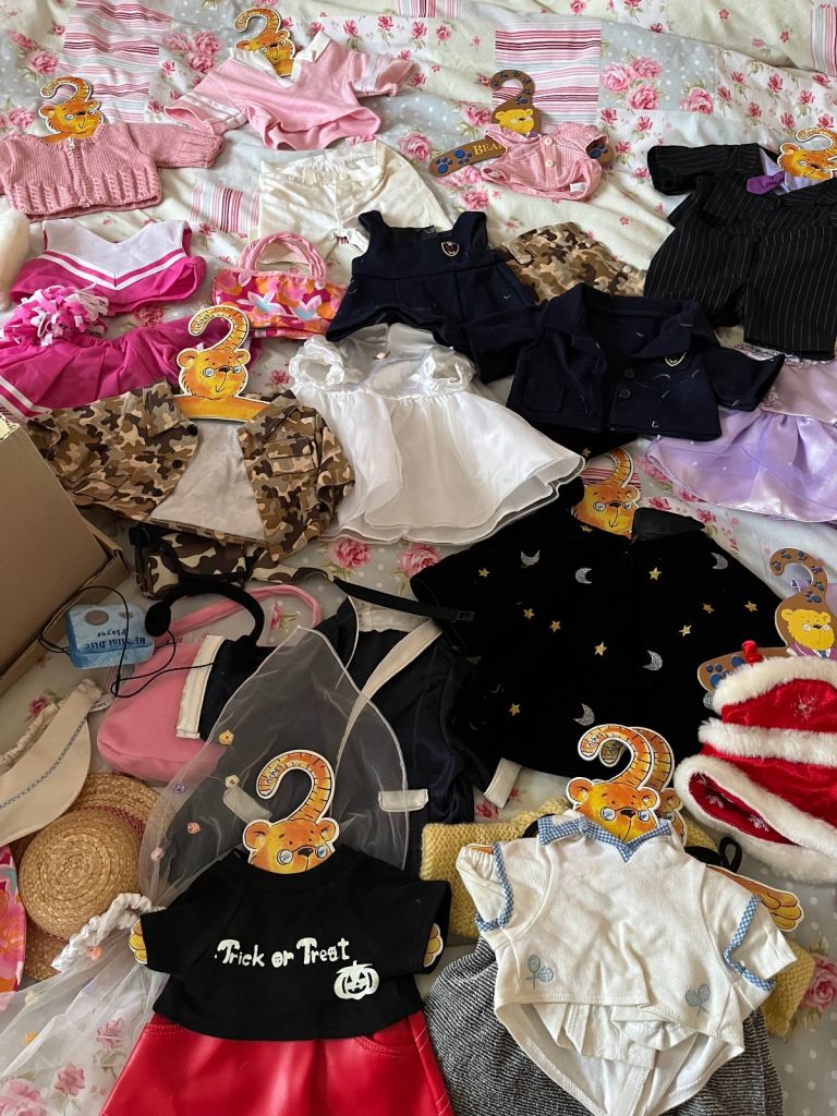 Box of teddy bear clothes 